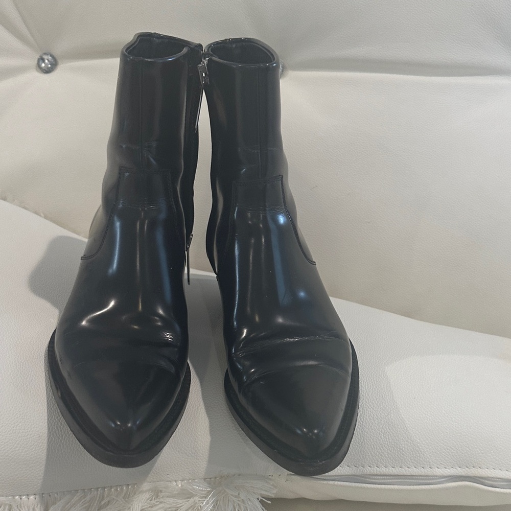 Calvin Klein Black Ankle Boots with a silver details on the souls